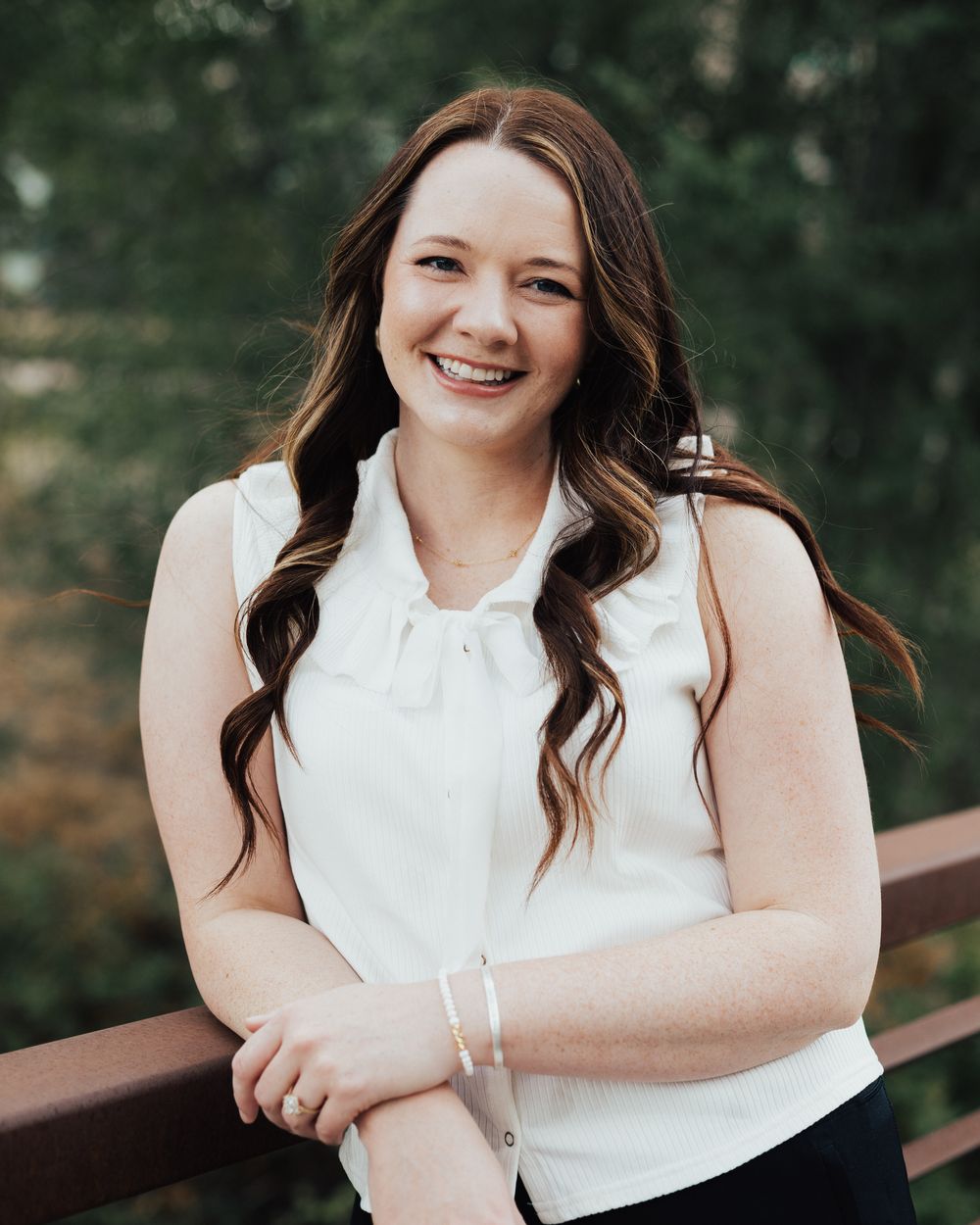 Caitlin Bailey, LCSW, smiling outdoors